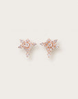 Diamond-studded rose gold earrings in a geometric starburst design.