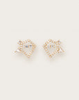Gold earrings with diamond-studded geometric frames and baguette and triangle-cut diamond accents
