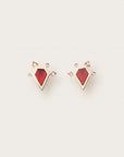 Gold earrings with red geometric stones and diamond-studded arrow-like accents