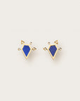 Gold earrings with blue geometric stones and diamond-studded arrow-like accents