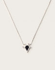 White gold necklace with black geometric pendant and small diamonds