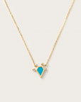 Gold necklace with turquoise geometric pendant and diamond accents