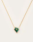 A geometric pendant necklace featuring vibrant green malachite framed in pavé-set diamonds, centered on a dainty yellow gold chain—modern elegance with a bold twist.