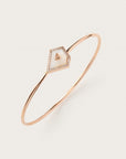 Rose gold bangle with ivory geometric stone and diamond border