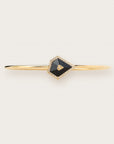 Gold bangle with black geometric stone and diamond accents