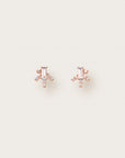 Rose gold earrings with baguette-cut center stones and radiating diamond-studded bars