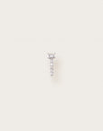 White gold stud earring with pavé diamonds and a baguette-cut center stone