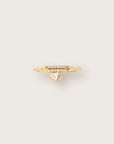 Yellow gold ring with a double pavé diamond band and a unique dangling triangle-cut diamond charm.