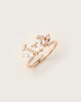 Rose gold open ring featuring an abstract, multidirectional arrangement of baguette, marquise, and pavé-set diamonds.
