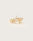 A bold yellow gold ring featuring a fan-like spray of baguette, pear, and marquise diamonds, elegantly arranged for a modern, architectural look.