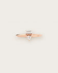 Rose gold ring with a baguette and pear-cut diamond duo