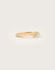 A contemporary yellow gold ring with a refined open band design, accented by pavé-set diamonds and a single marquise-cut diamond—effortlessly chic with a touch of elegance.