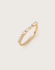 Yellow gold ring with alternating baguette and round-cut diamonds in a sleek, modern setting.