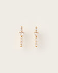 Yellow gold drop earrings featuring vertical pavé diamond bars topped with inverted trillion-cut diamonds.