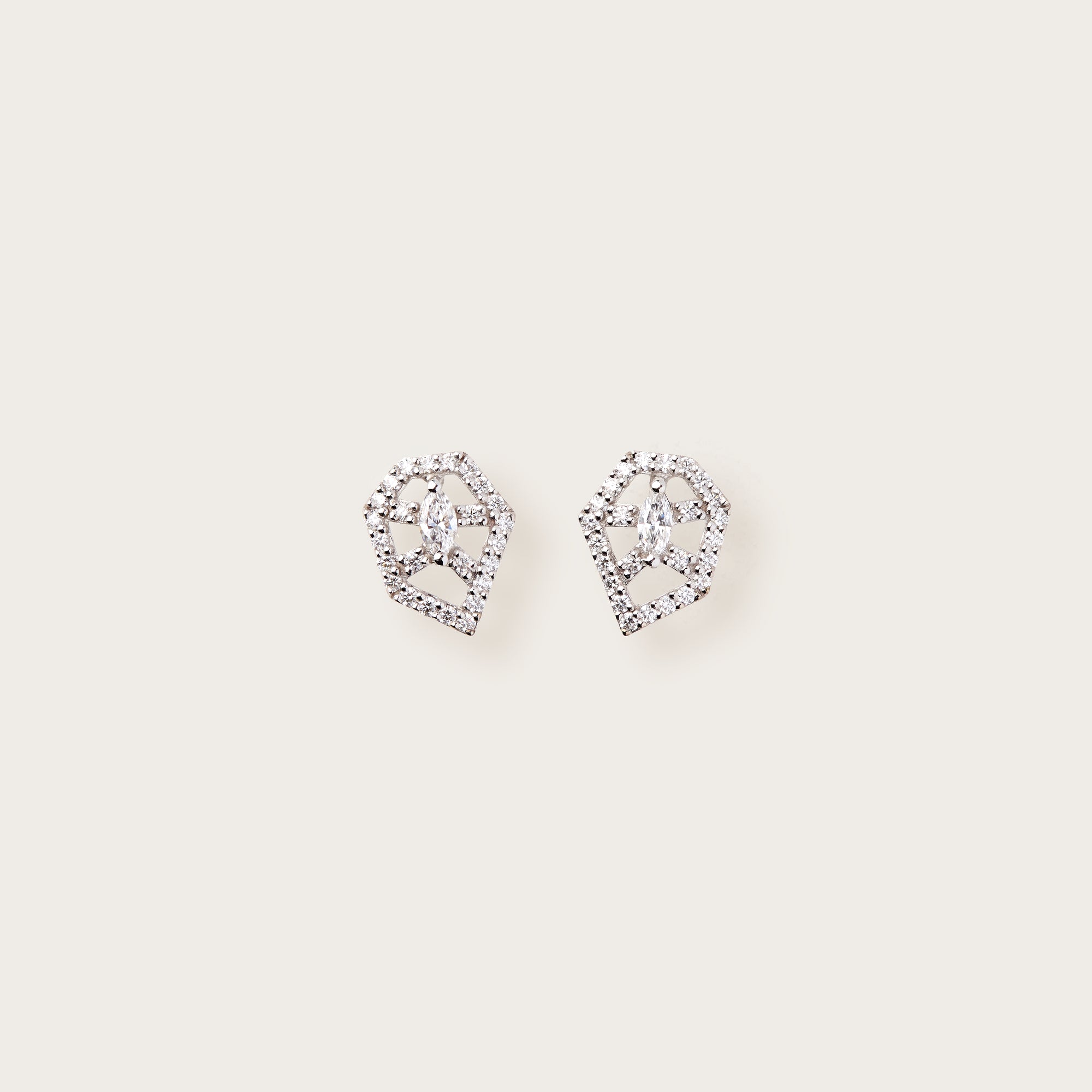 White gold earrings with diamond-studded pentagon frames and marquise-cut center stones